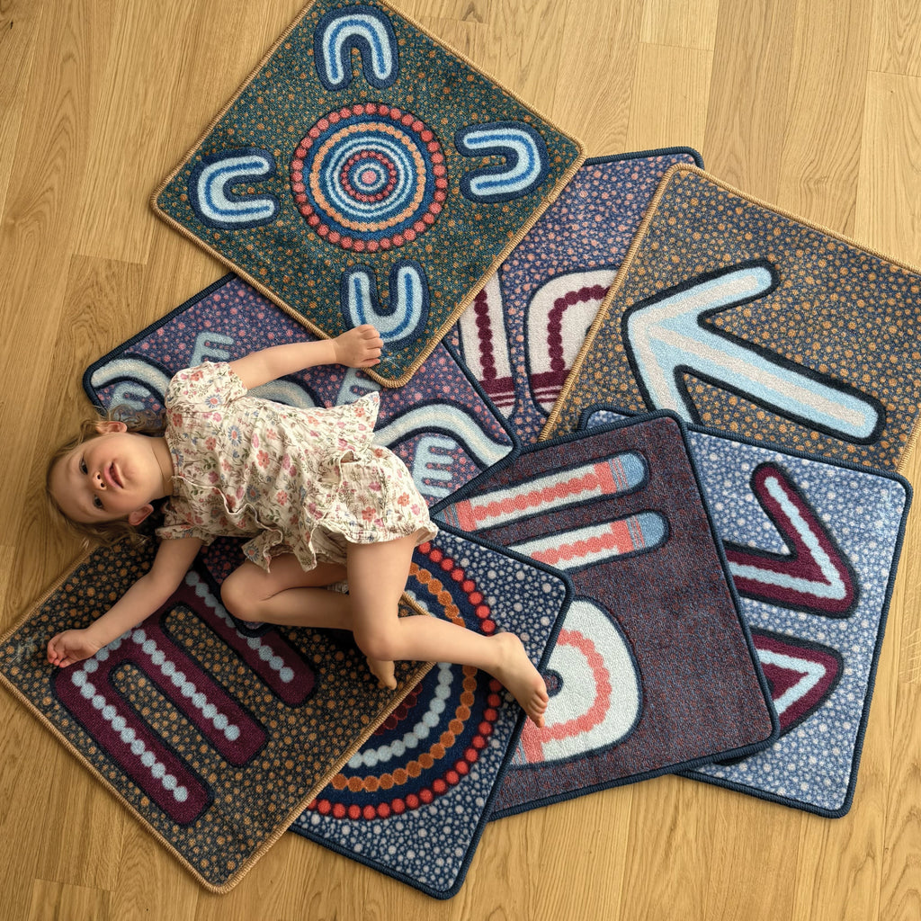 Indigenous Symbols Rug Squares — side view