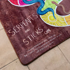Serpents and Sticks Rug Game with soft Dice — side view