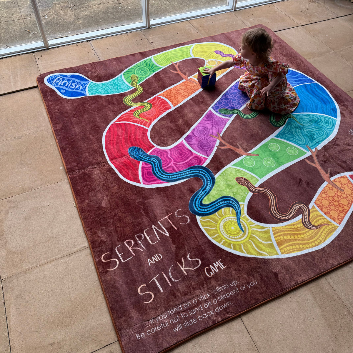 Serpents and Sticks Rug Game with soft Dice — reverse view