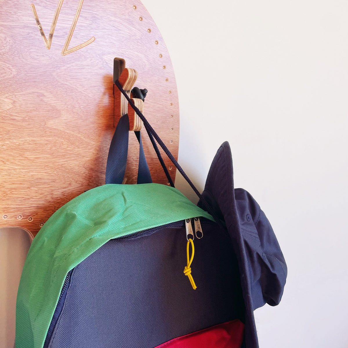 Wall Serpent Bag and Hat Hanger — in classroom use