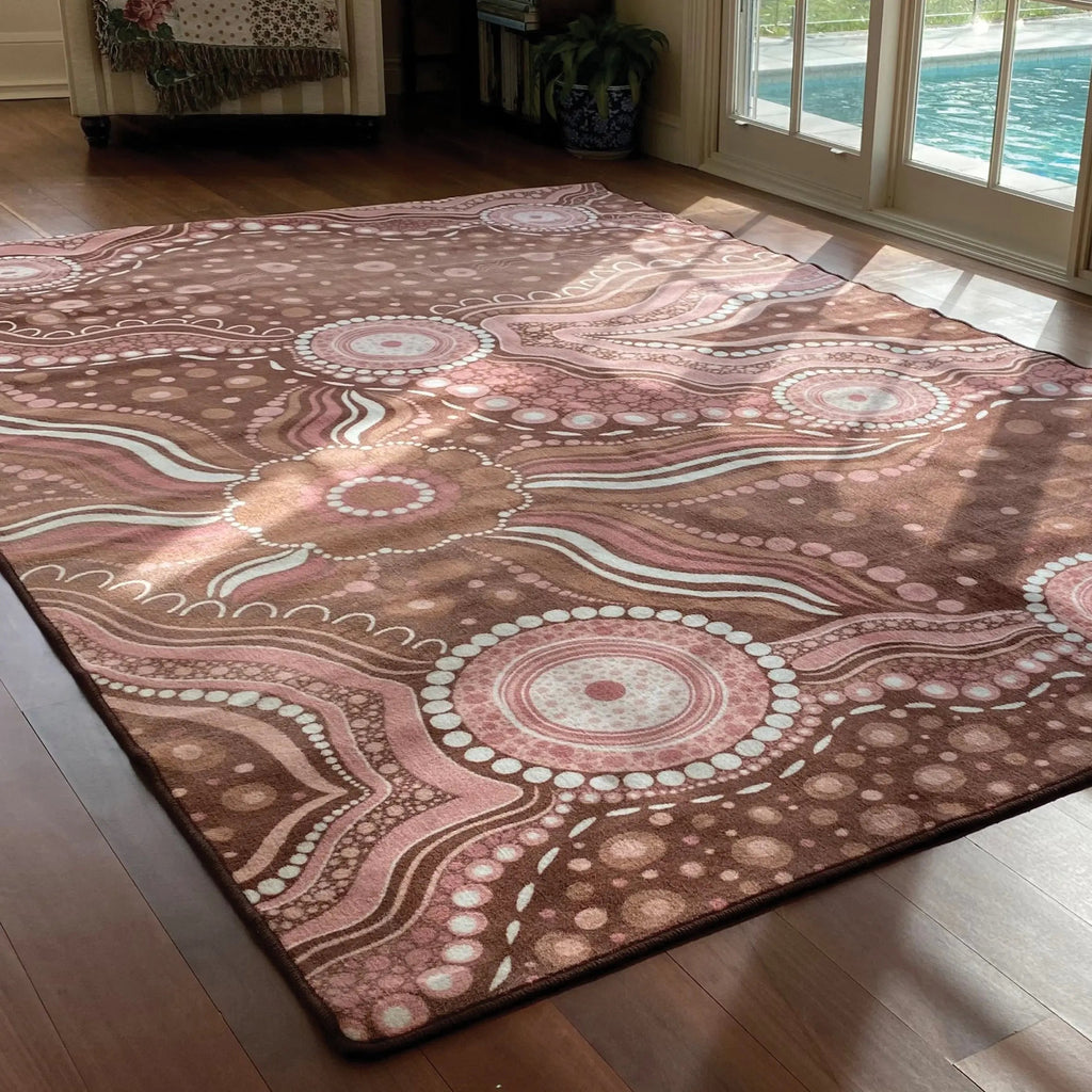 Aboriginal Art Bush Dreaming rug in classroom — children sitting on Indigenous art rug during group reading time