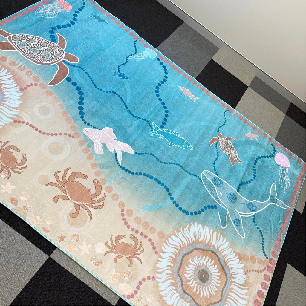 Under the Sea Dreaming Indigenous rug in classroom — children sitting on large Aboriginal art rug celebrating Sea Country and marine culture